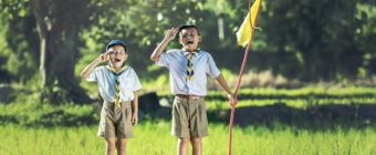 Selling a Home | Pledge | Two boys saluting yellow flag