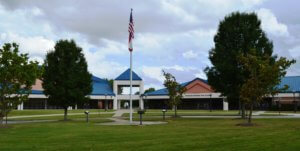 kennesaw mountain high school building with American flag in front