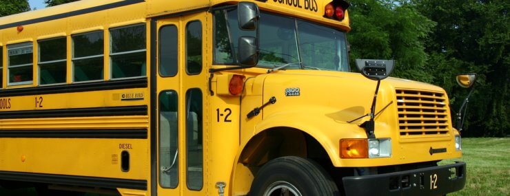 front of yellow school bus waiting for children